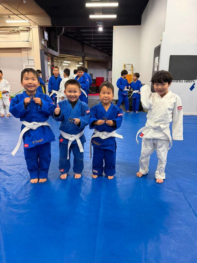 Young judo students with medals